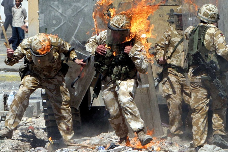 British Army troops covered in flames from petrol bomb, Basra, Iraq