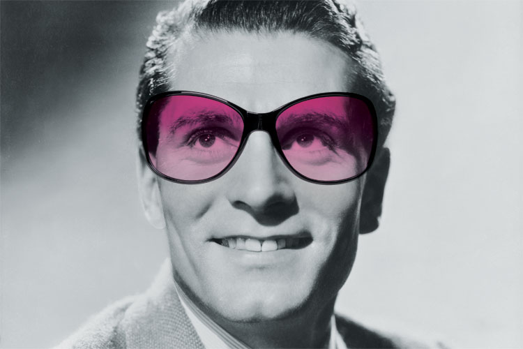 Laurence Olivier wearing purple sunglasses