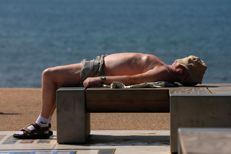 Man sunbathing, Blackpool, England