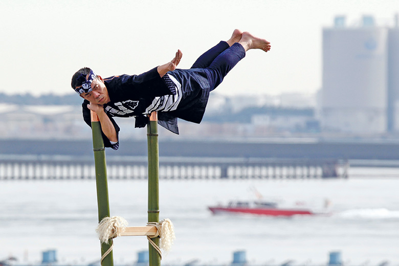 Ninja balancing on bamboo