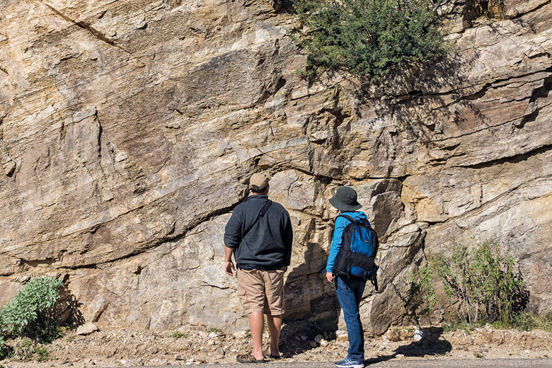 People looking at a rock