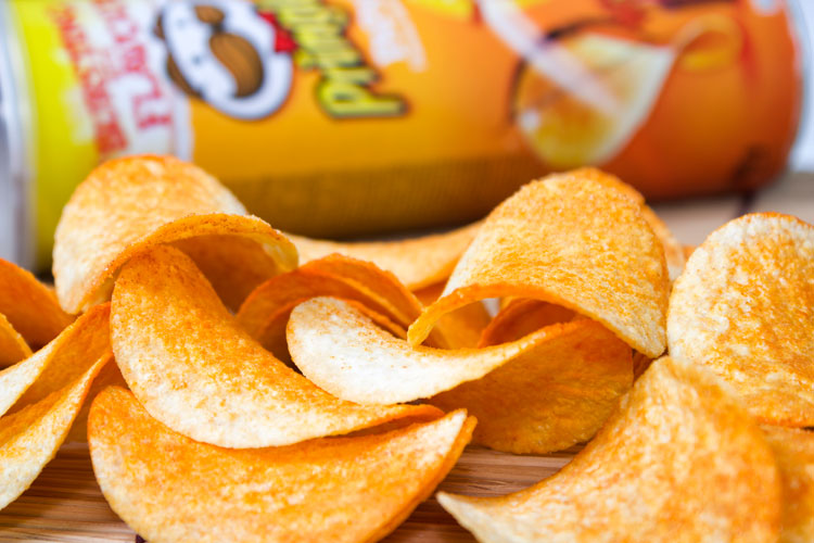 Pringles crisps spread on table