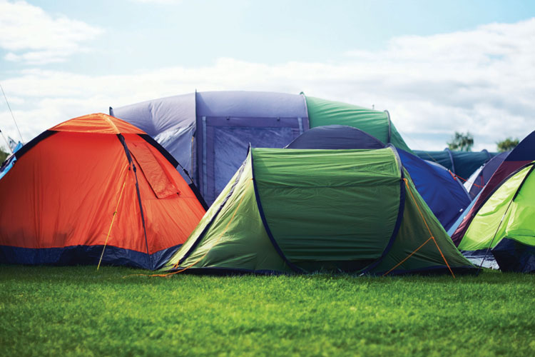 Row of tents in field