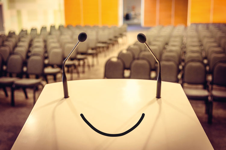 Smiling face on lecture hall podium