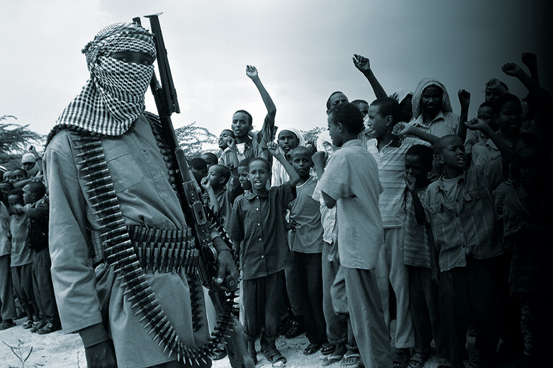 Somali boys chant as they watch parade of Al-Shabab Islamist fighters, Mogadishu