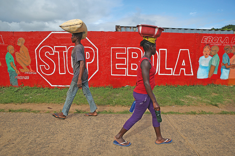 Stop Ebola sign written on wall
