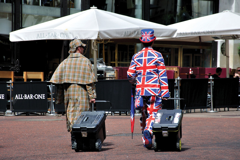 Street performers dressed in Sherlock Holmes and Union Jack costumes, London