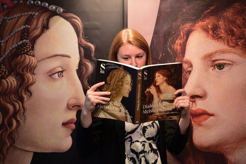 Woman reading art book