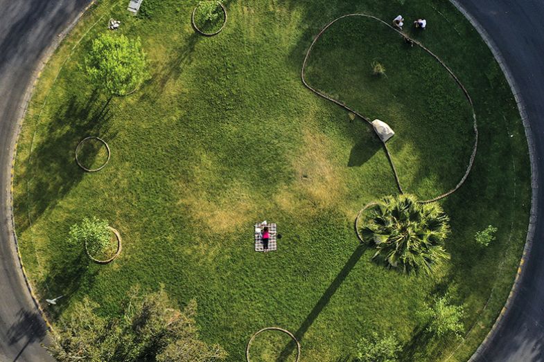 Aerial view of a woman at an empty park in Santiago on April 20, 2020