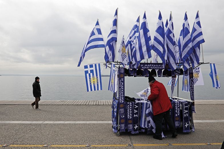 A street vendor sells Greek and Macedonian flags on Thessaloniki’s seafront promenade