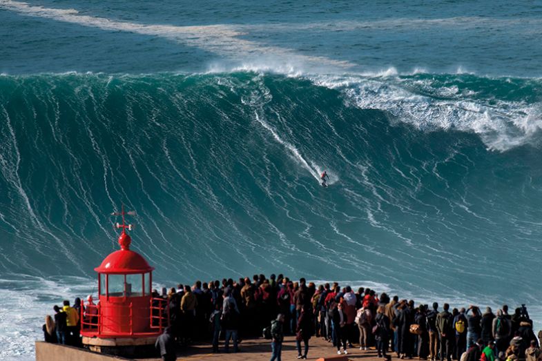 Brazilian surfer Rodrigo Koxa rides a wave in Nazare on November 20, 2019