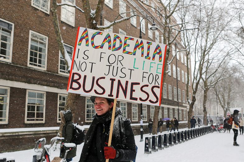 A university staff member protesting in the snow 2018