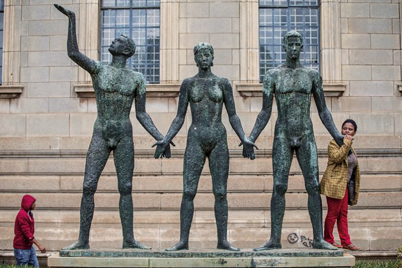 Sculpture of woman and two men