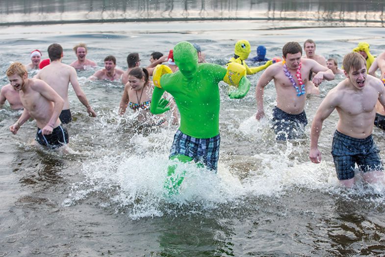 Man in green suit takes a swim