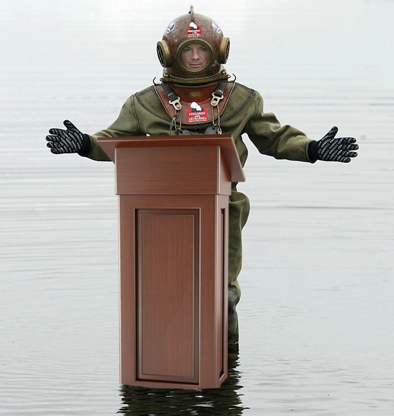 Diver at a lectern in water