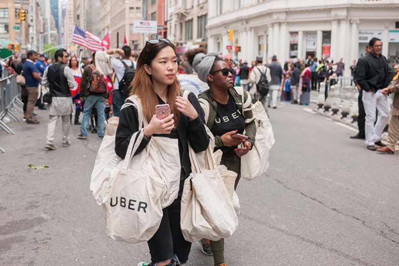 Woman carries Uber-branded bag