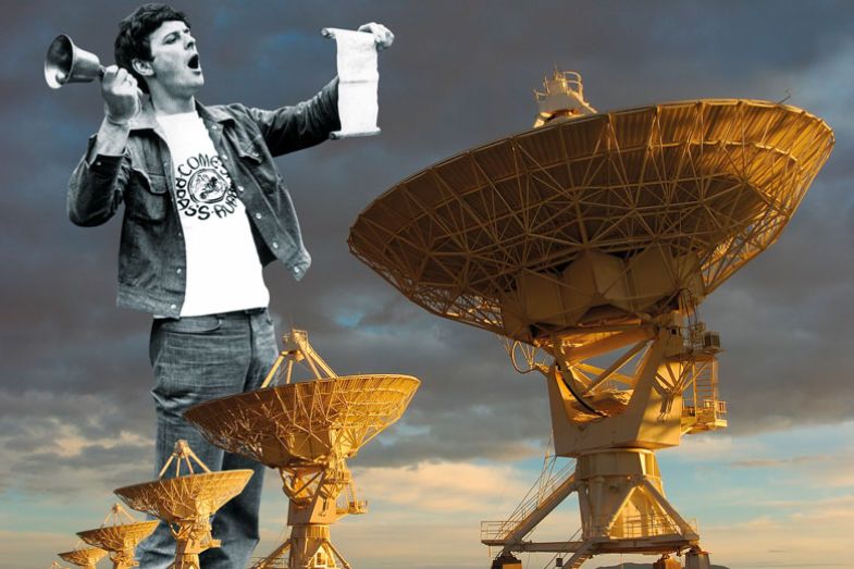 Row of Radio Telescopes man holding bell reading from paper