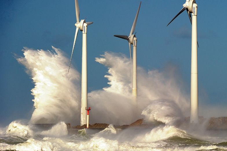 Waves break on a jetty holding wind turbines on November 2013 in the Channel port of Boulogne-sur-Mer, France