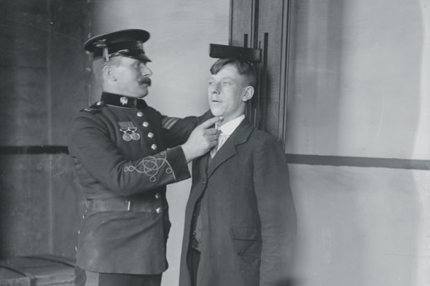 A man measuring the height of another man