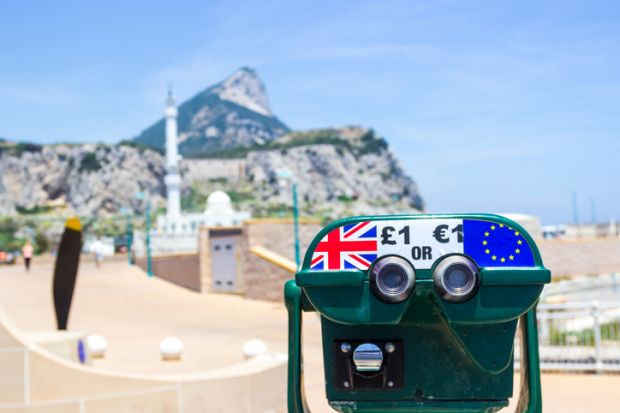 A binocular on the Rock of Gibraltar with Pound and Euro symbols represents Brexit