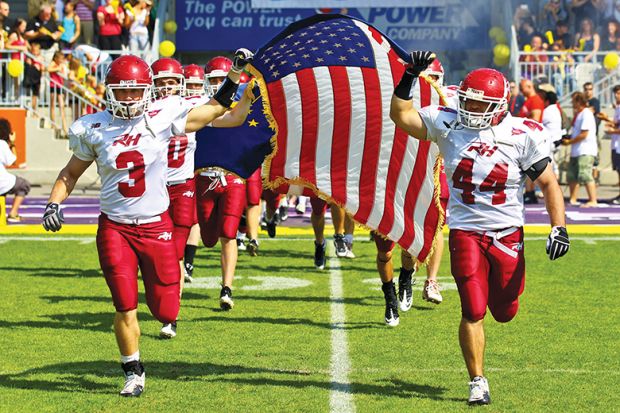 The American football team of Rose Hulman College entering the Hohe Warte Stadium illustrating issues with culture of US college sports