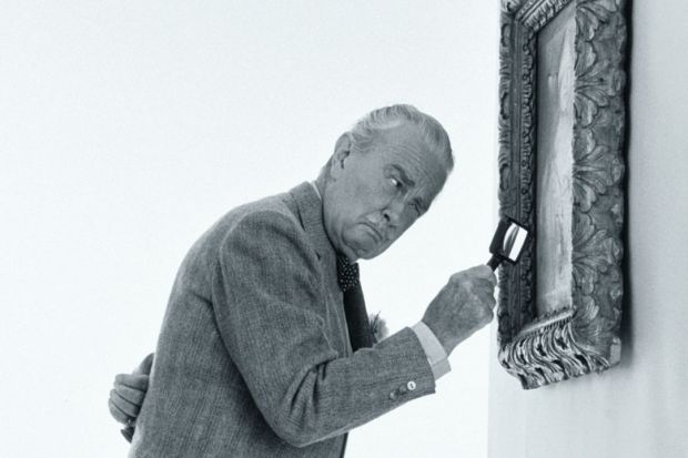 Art critic examining painting