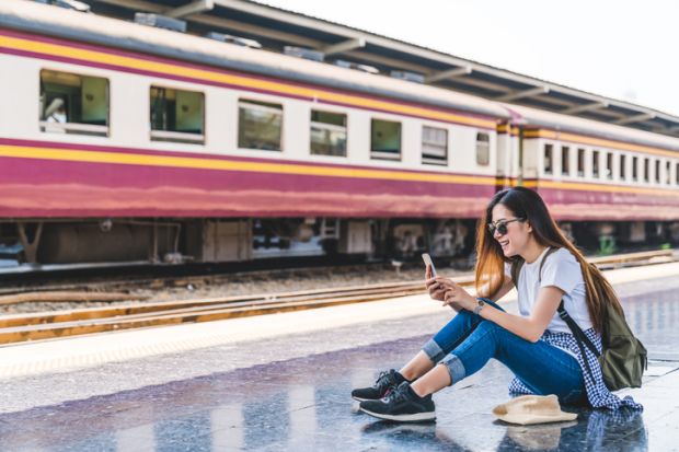 Asian tourist teenage girl at train station