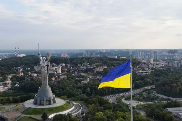 Aug-2021, Kiev, Ukraine  An aerial view of Kiev and the Motherland Monument in Kyiv (Kiev), Ukraine. Ukraine flag