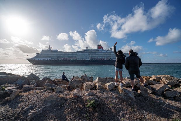 People waving off a luxury cruise ship as it leaves Adelaide, Australia. To illustrate the growing divide between rich universities and poorer ones.