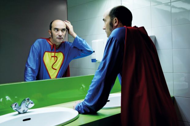 Balding superhero checking hair in mirror