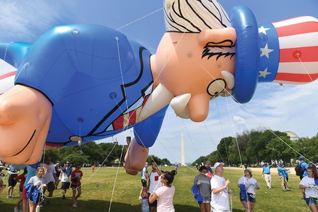 Participants pulls a balloon for the Independence Day parade in Washington, DC, illustrating review of ‘This Is Not Normal: The Politics of Everyday Expectations’ by Cass R. Sunstein