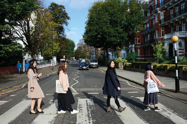 Chinese women walk across Abbey Road, London to illustrate Chinese women ‘see study as an escape’ 