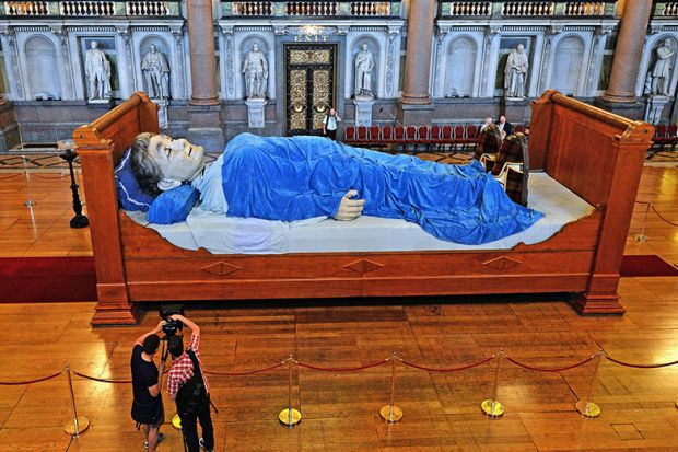 Sculpture of giant in bed