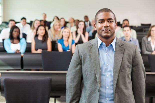 A black academic in a lecture hall