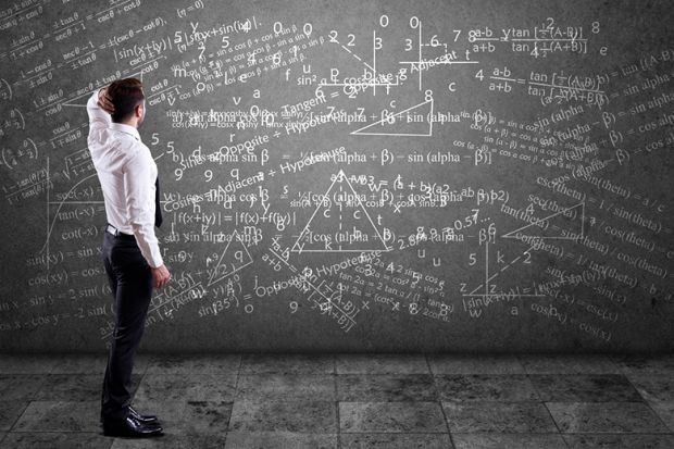Blackboard covered in maths equations