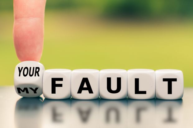 A finger turns a dice and changes the expression "my fault" to "your fault"