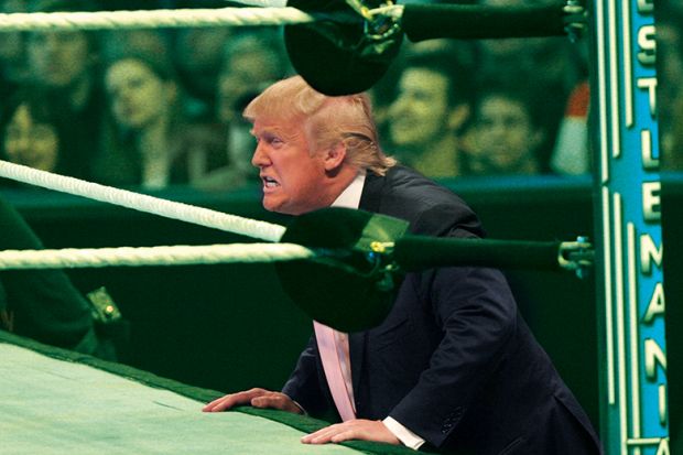 Trump next to a wrestling ring 