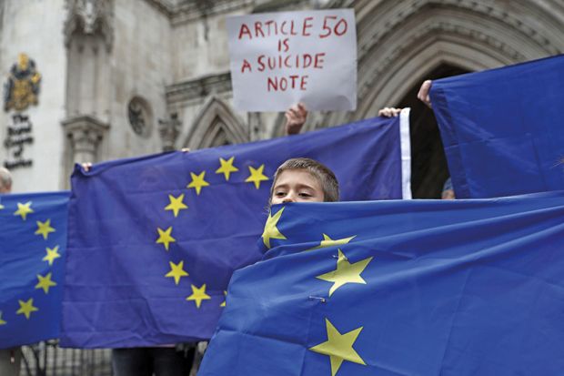 Boy shrouded in EU flag
