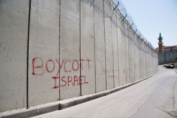 'Boycott Israel' graffiti on Israeli separation wall illustrating review of ‘Conflict Graffiti: From Revolution to Gentrification’ by John Lennon