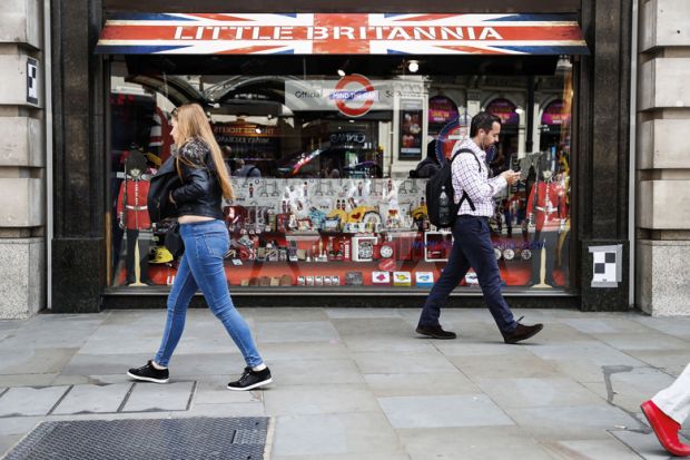 People walking past Little Britannia shop, London