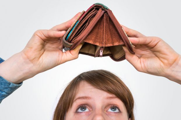 Business woman holding an empty wallet, she hasn't money