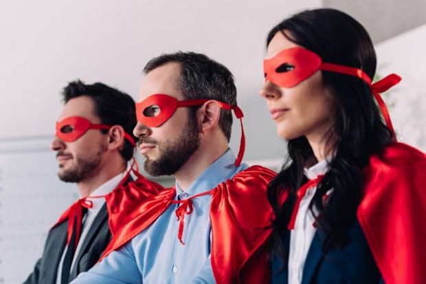 Businessmen and woman in superhero outfits