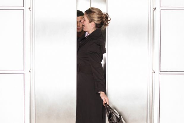Businesswoman squeezing through elevator/lift doors