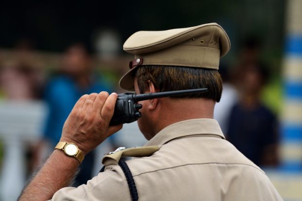 Calcutta, India - August 15, 2014 Indian police with walkie talkie.
