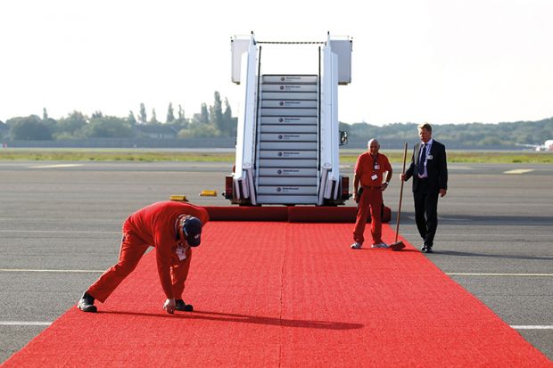 rolling out red carpet at airport