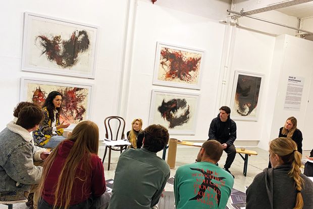 Mexican artist Chantal Meza speaking at student workshop