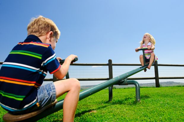 Children on the seesaw in a playground