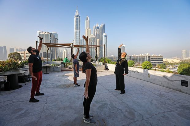 Instructor teaching Chinese martial arts on roof of building in Dubai
