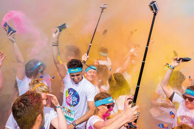 Birmingham Color run 2016. Young people with selfie sticks