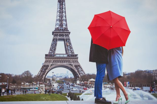 Couple kissing near Eiffel Tower illustrating a story about the court case over University of Paris name